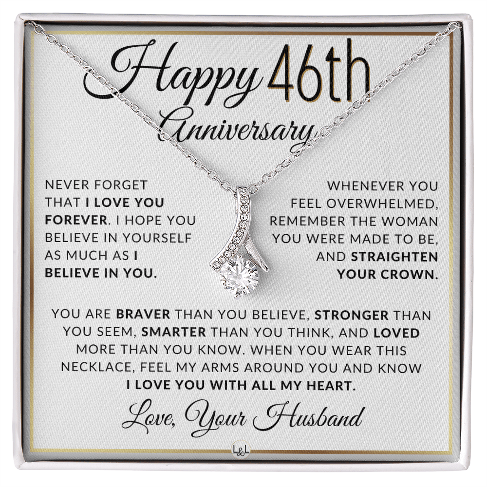 Silver 46th birthday necklace with a rhinestone pendant, presented on a square white gift card with anniversary messages and the text 'Love, Your Husband'.
