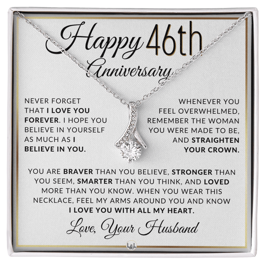 Silver 46th birthday necklace with a rhinestone pendant, presented on a square white gift card with anniversary messages and the text 'Love, Your Husband'.