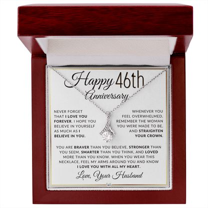 Silver 46th birthday necklace with a rhinestone pendant, presented on a square white gift card with anniversary messages and the text 'Love, Your Husband'.